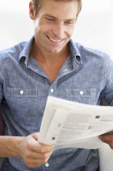 Man reading instruction book